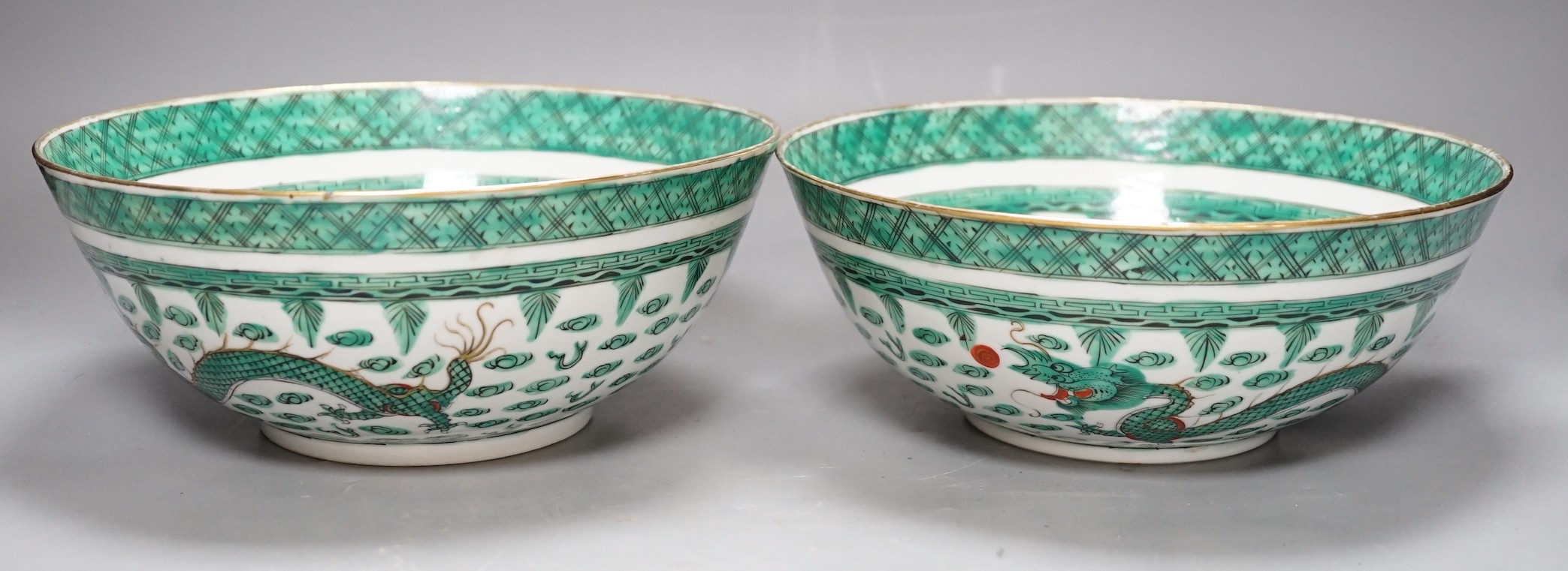 A pair of Chinese green enamelled ‘dragon’ bowls, 20th century, 23cm diameter